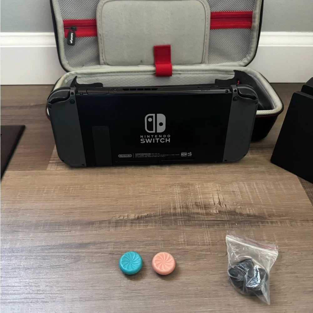 Nintendo Switch with Black and Gray Accessories